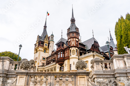 Peles castle and Pelisor castle late morning during spring season . One of the most beautiful classical Art Nouveau castle in Sinaia , Transylvania , Romania