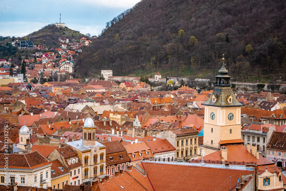 Panoramic view of Brasov from White tower and Black tower in the evening during spring season . One of the most famous view points in the heart of Brasov , Transylvania , Romania