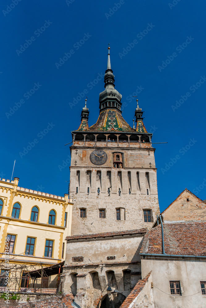 The clock tower in old town of Sighisoara  afternoon during spring season . One of the most impotant tower . Also Sighisoara is Unesco sites of the country , Sighisoara , Transylvania , Romania