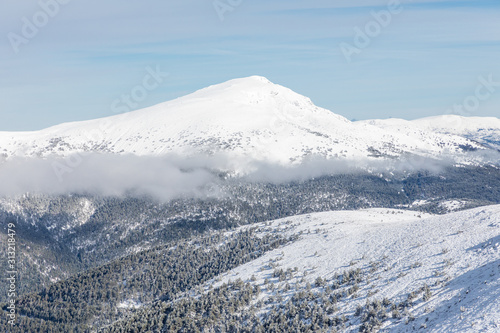 Snowy mountains in the Sierra de Guadarrama of Madrid seen from the ascent to Guarramillas © josevgluis