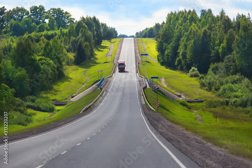 Truck delivers cargo on a country highway