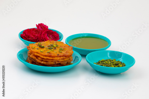 Indian Traditional Popular Sweet Food Malpua or Amalu isolated on White Background photo