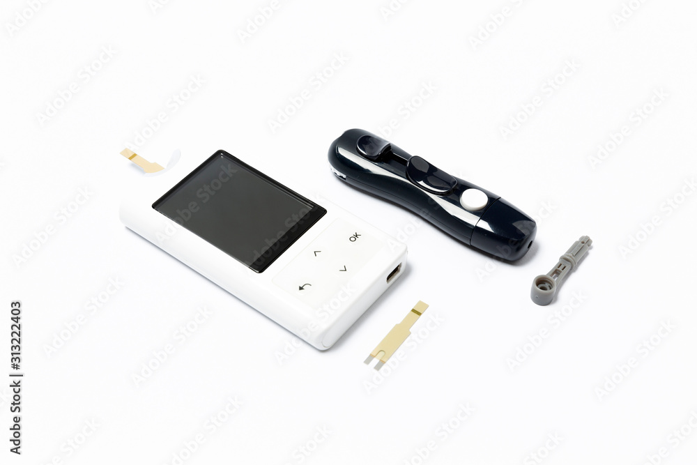 glucometer and accessories isolated on white background glucometer and accessories isolated on white background