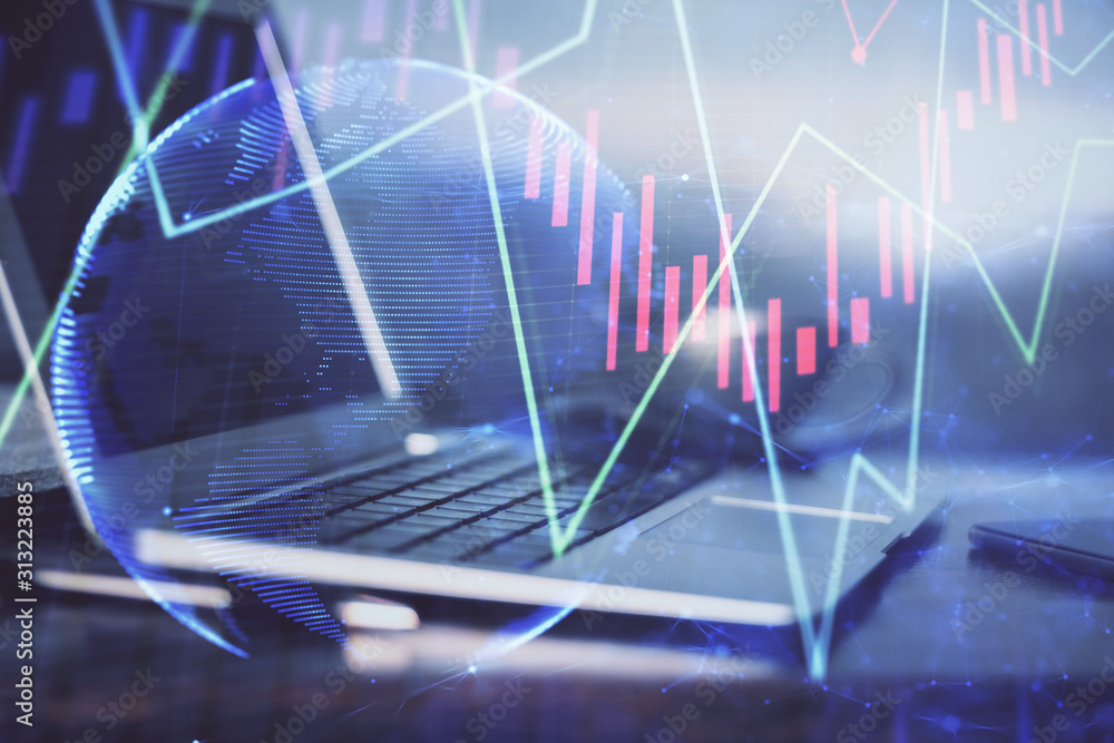 Forex market chart hologram and personal computer background. Multi exposure. Concept of investment. Forex market chart hologram and personal computer background. Multi exposure. Concept of investment.