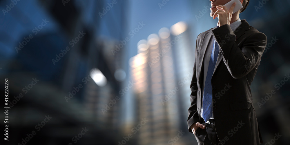 Businessman having mobile talk . Mixed media Businessman having mobile talk . Mixed media