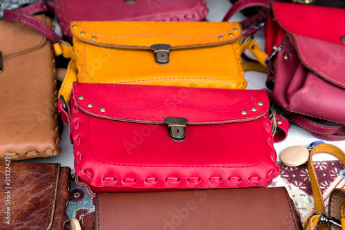 Multicolored leather women's clutches close-up.