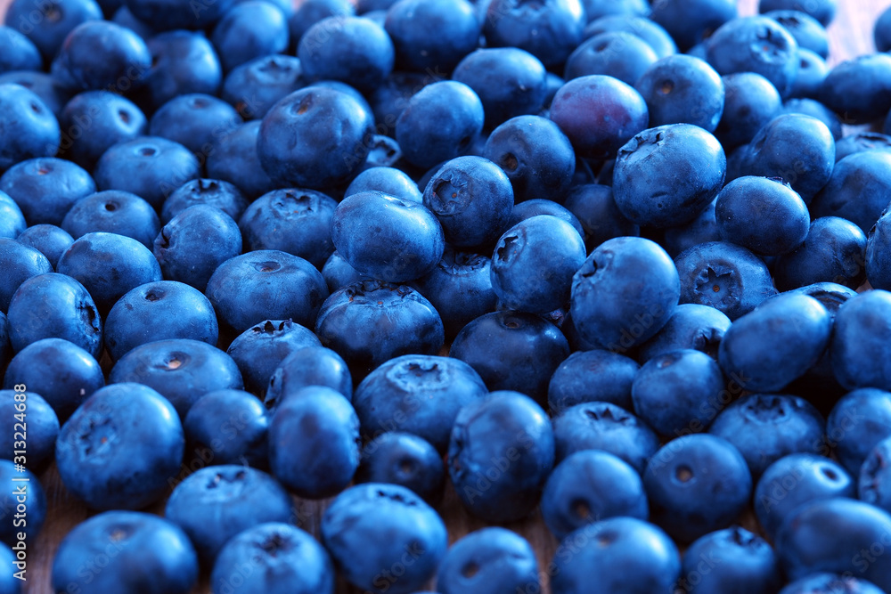 Blueberry berry on a wooden table. Summer and vitamins Blueberry berry on a wooden table. Summer and vitamins