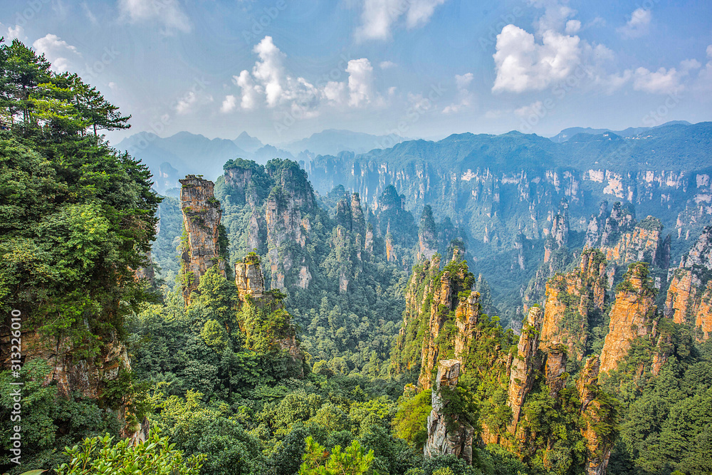  Amazing view of natural quartz sandstone pillar the Avatar Hallelujah Mountain among green woods and rocks in the Tianzi Mountains, the Zhangjiajie National Forest Park, Hunan Province, China.