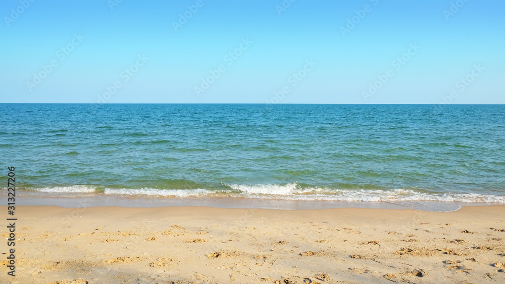 Fototapeta premium Clear sand beach and sky background.