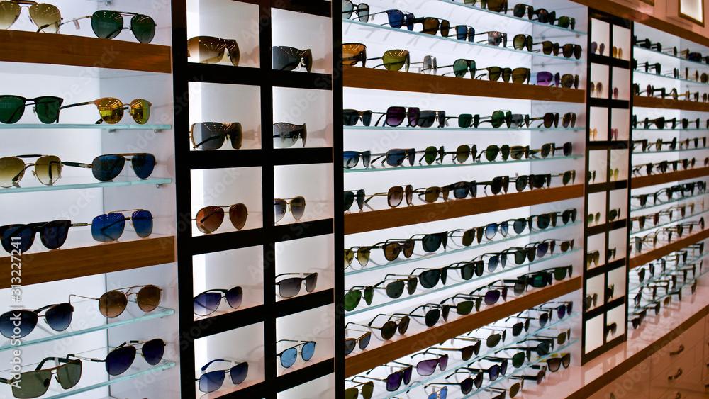 Types of sunglasses, sun glasses on store shelves, optician