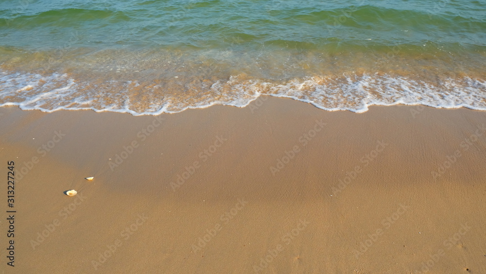 Ocean wave on beach with sea shell on vacation time. Ocean wave on beach with sea shell on vacation time.