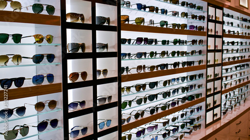 Types of sunglasses, sun glasses on store shelves, optician