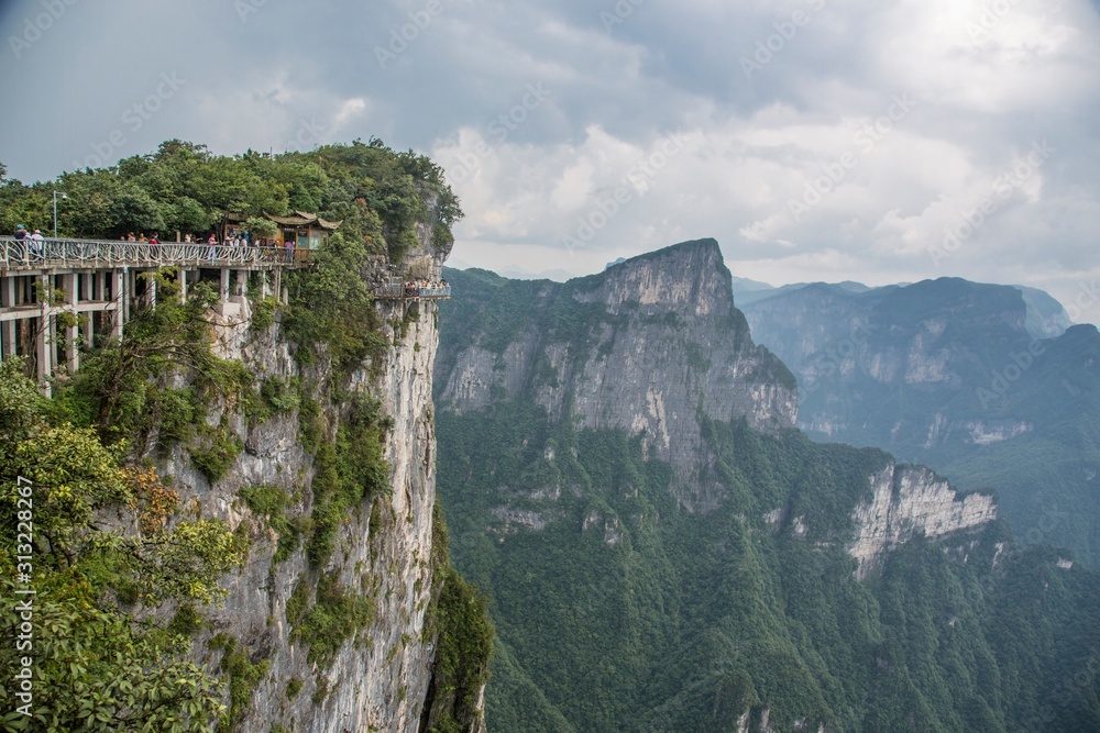 Cable car above winding road in Tianmen mountain, China. Cable car above winding road in Tianmen mountain, China.