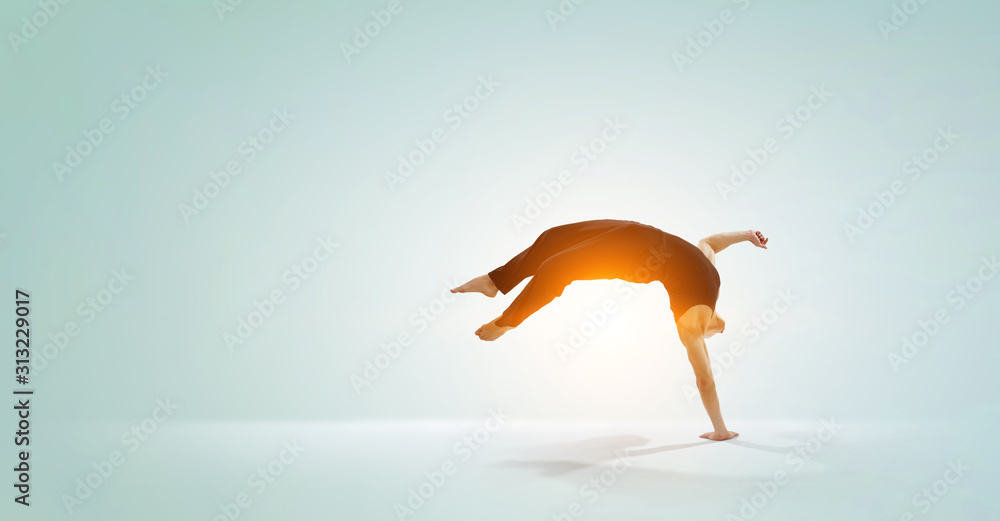 Fototapeta premium Dancer guy in jump. Mixed media