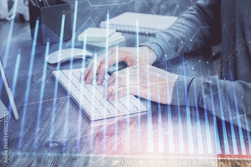 Double exposure of financial graph with man works in office on background. Concept of analysis.