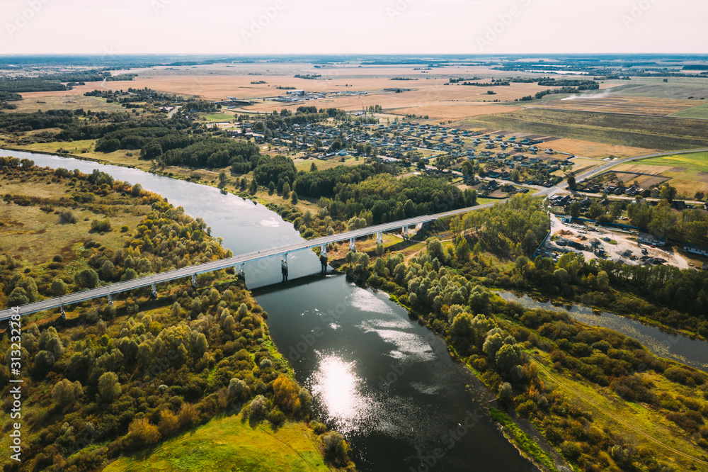 Chachersk, Belarus. Aerial View Of Bridge over the Sozh river In Summer Day. Top View Of Beautiful European Nature From High Attitude In Summer Season. Drone View. Bird's Eye View