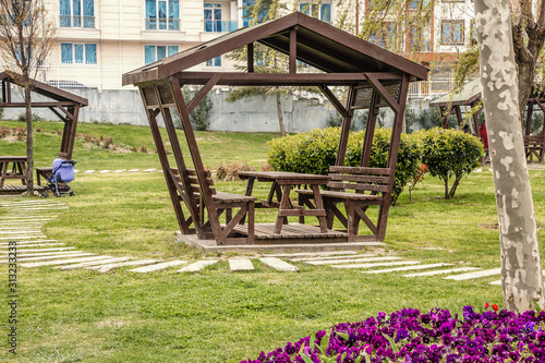 summer wooden gazebo for rest and picnic in one of the parks of Istanbul photo