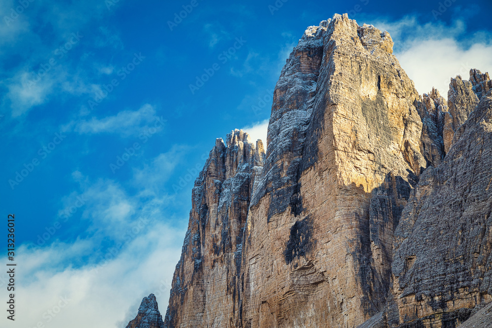 Rocky peaks and cloudy blue sky, Tre Cime di Lavaredo park, Italy