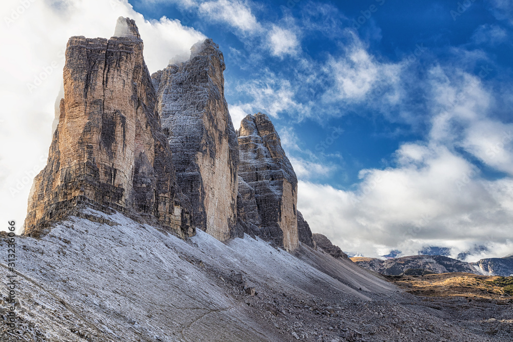 Famous view of Tre Cime di Lavaredo rocky mountains from the hiking trail, Dolomites, Italy Famous view of Tre Cime di Lavaredo rocky mountains from the hiking trail, Dolomites, Italy