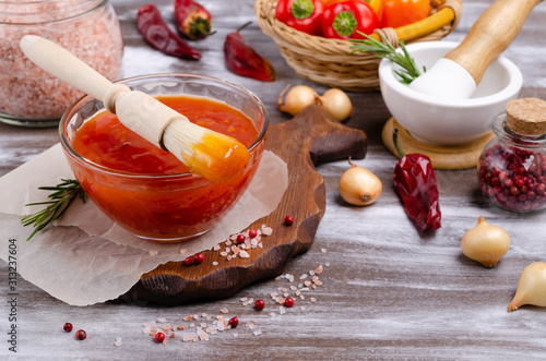 Homemade barbecue sauce in glass photo