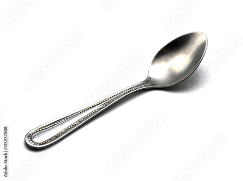 shiny stainless steel spoon in isolated on white background