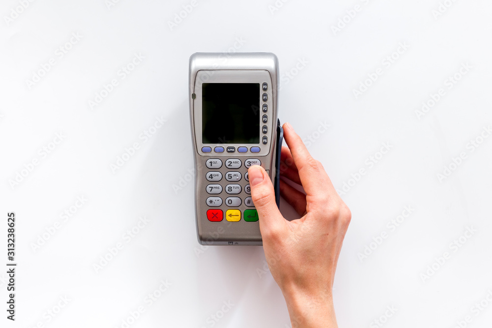 Payments security. Hand enters pin - password - on white background top-down copy space Payments security. Hand enters pin - password - on white background top-down copy space