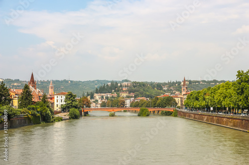 Verona, Italy. View of Adige river embankment in sunny day.