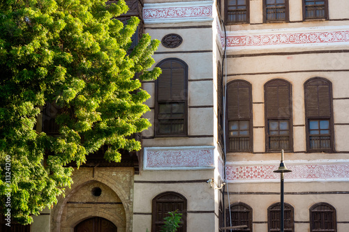 Close-up view of the ornate facade of the Nasseef coral town house at the Souk al Alawi Street in the historic district of Al Balad, Jeddah, KSA photo