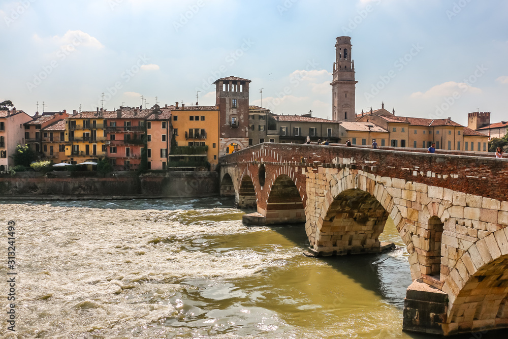 Verona, Italy. View of Ponte Pietra bridge in sunny day.