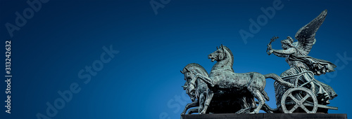 Canvas Print Panoramic banner of ancient bronze quadriga statue of goddess of Victory at Aust
