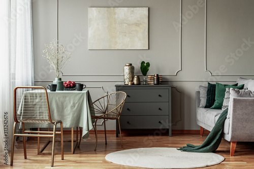 Elegant living and dining room interior with green and grey design