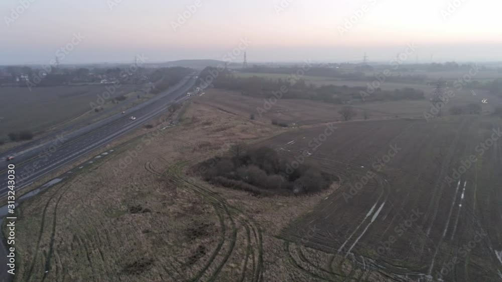 Aerial view above England motorway & bridge crossing in Autumnal countryside at sunrise. Aerial view above England motorway & bridge crossing in Autumnal countryside at sunrise.