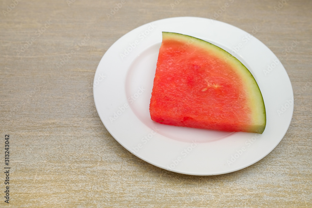 Slice of watermelon on a table Slice of watermelon on a table