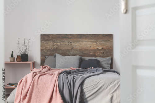 Copy space on empty white wall of rustic bedroom interior © Photographee.eu