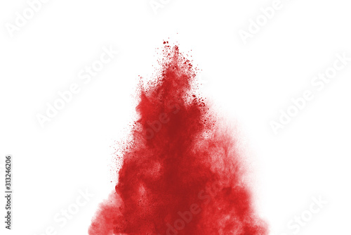 Red powder explosion isolated on white background. Colored cloud. Colorful dust explode. Paint Holi.
