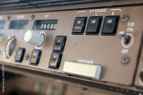 Flight Mode Control Panel with the Autopilot engage buttons and the Autopilot disengage bar on the Flight Deck of a Jumbo Jet
