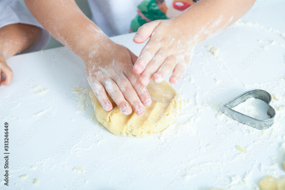 Family cooking homemade cakes. Moms and children hands holding cookie cutters. Family Cooking flat lay. Sweet home. Happiness concept. Family cooking homemade cakes. Moms and children hands holding cookie cutters. Family Cooking flat lay. Sweet home. Happiness concept.