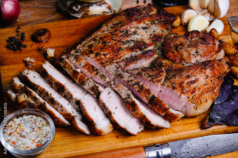 roasted ham composition on a wooden background roasted ham composition on a wooden background
