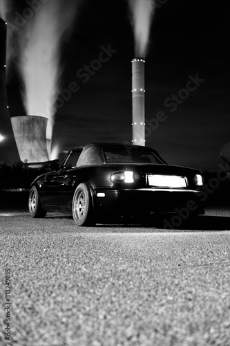 Fotografie Mazda MX-5 Miata in front of brown coal power station