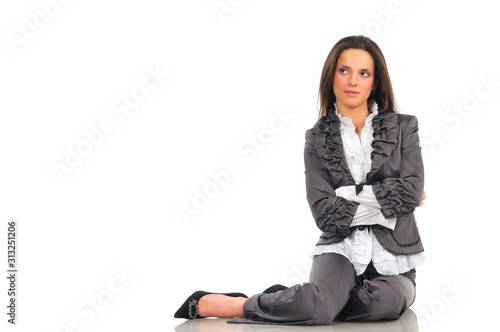 Girl in suit sitting on the floor