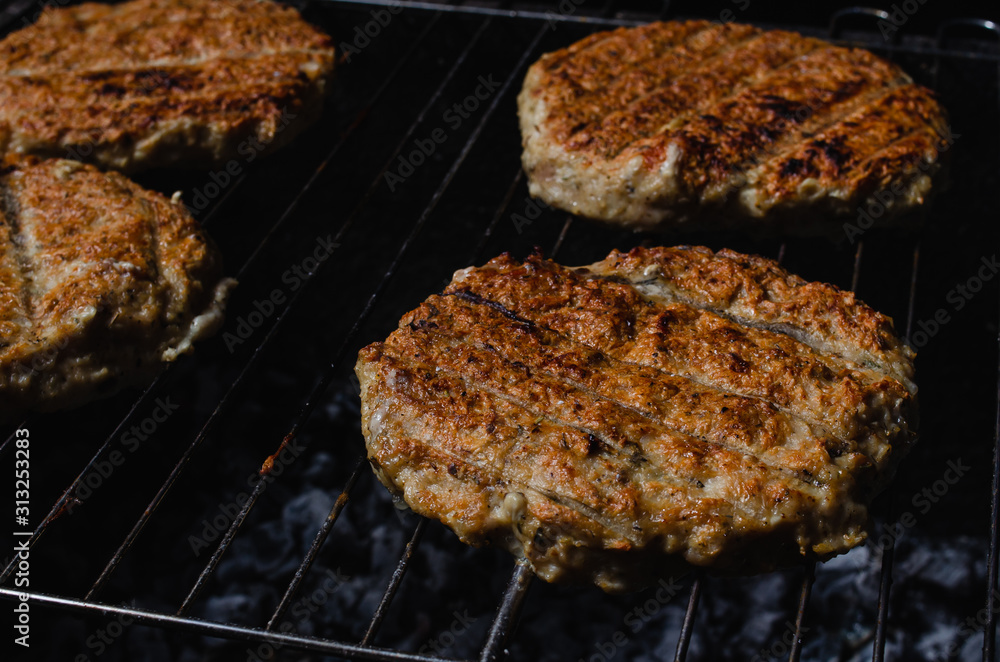 chicken burger composition on a bbq grill chicken burger composition on a bbq grill