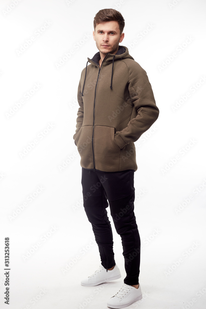 Man wearing in khaki hoodie isolated on white background. Man wearing in khaki hoodie isolated on white background.