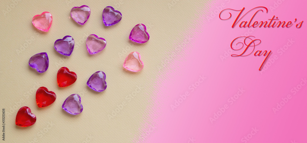 Banner in a horizontal position, on a pink background. 13 crystal hearts pink, purple and lilac shades. With space for text. And the inscription: Valentine's Day.