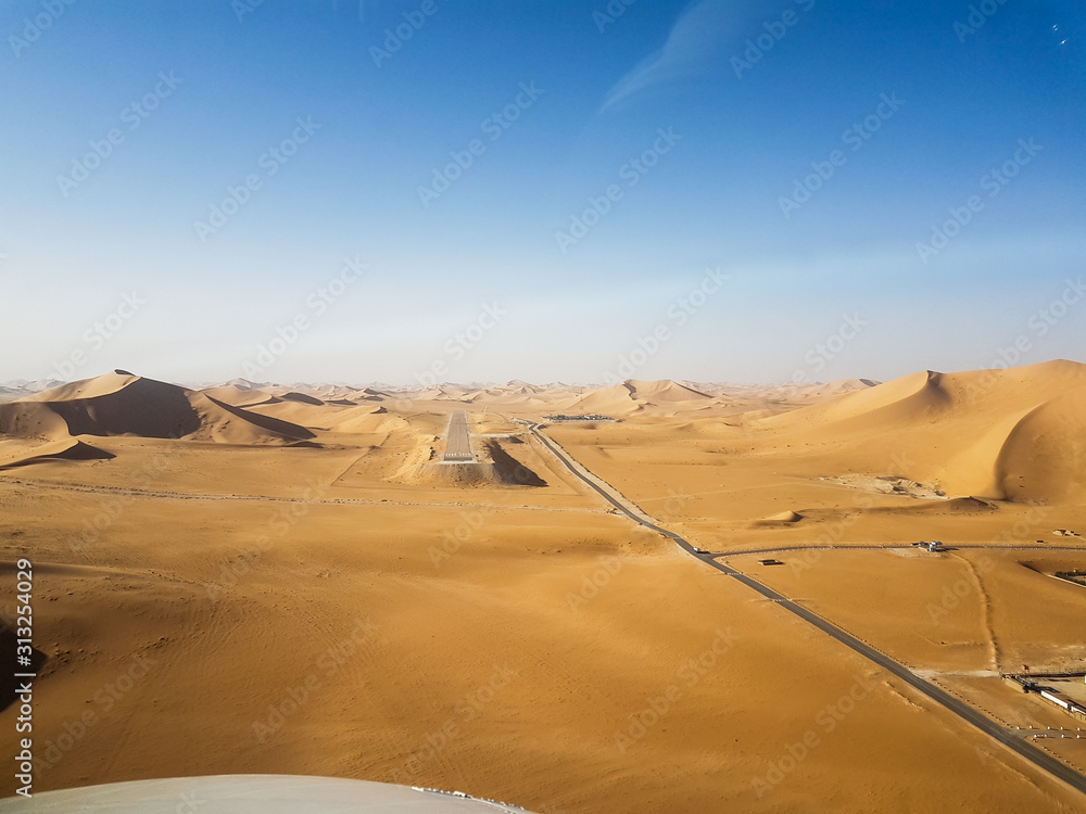 Runway between sand dunes