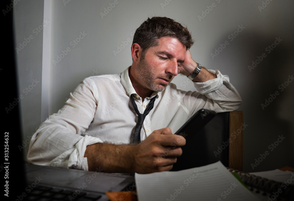 corporate business lifestyle portrait of stressed and exhausted businessman working frustrated at office computer desk overworked with paperwork as upset executive suffering stress corporate business lifestyle portrait of stressed and exhausted businessman working frustrated at office computer desk overworked with paperwork as upset executive suffering stress