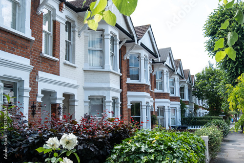 Row of red brick terraced houses photo