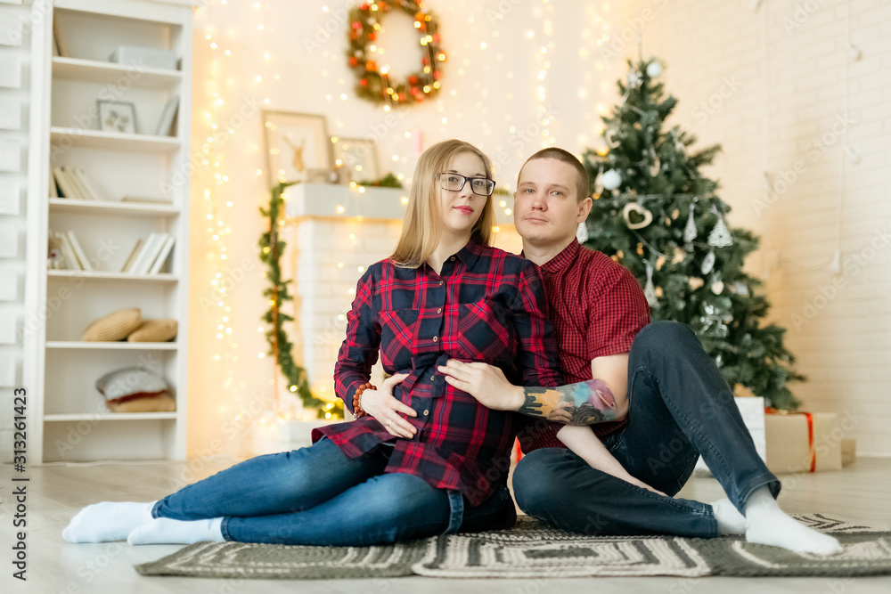 Married couple expecting baby at Christmas Married couple expecting baby at Christmas
