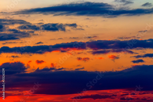 orange sunset sky with clouds. beautiful nature background