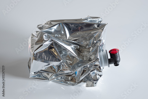 Crumpled plastic wine bag on white background