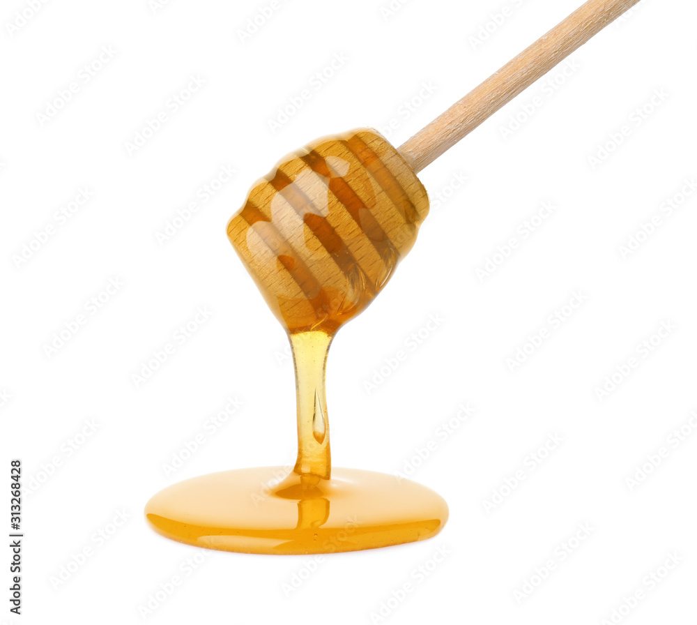 Honey pouring from wooden dipper isolated on white Honey pouring from wooden dipper isolated on white
